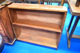 A stained pine low bookshelf, width approx. 84cm
