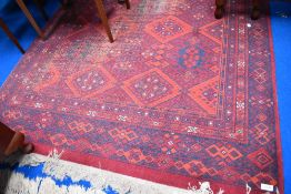 A traditional Persian style rug, quite worn