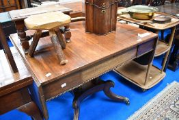 A 19th Century Regency rosewood sofa or breakfast table having concealed frieze drawer on