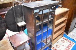 A late 19th or early 20th Century narrow bookcase on stand , height approx. 136cm