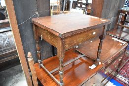 An early 20th Century stained frame side table or stool having lift lid and turned frame