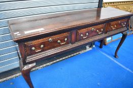 A period oak dresser base having three panelled drawers, width approx. 165cm