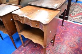 A pair of reproduction serpentine bedside chests