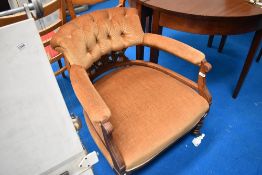 A Victorian mahogany framed armchair having later dralon upholstery