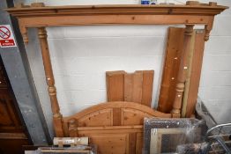 A modern pine half tester bed frame, having wide slat base