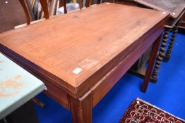 A vintage teak fold over card table, similar to those seen in military offices in past