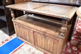 A traditional oak monks bench, width approx. 107cm