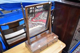 A Victorian mahogany toilet mirror having double drawer base