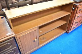 A vintage laminate bookshelf, with cupboard section