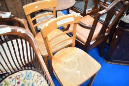 A pair of traditional beech kitchen chairs