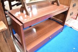 A vintage metamorphic tea trolley