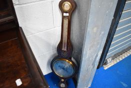 A Victorian rosewood cased onion top barometer having hygrometer, thermometer and level, with