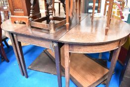 A 19th Century mahogany D end dining table , with centre legged section and two additional
