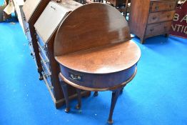A George II mahogany demi lune fold over tea table having two narrow wing drawers , with cabriole