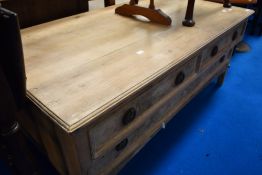 A stripped low drawer unit/coffee table