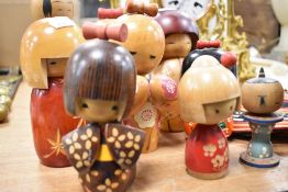 Ten vintage and modern Japanese wooden Kokeshi dolls hand crafted and decorated.
