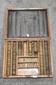 A late Victorian Early 20th century Opticians Optical lens set in fitted mahogany case.