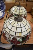 Two vintage Tiffany style leaded light ceiling shades with floral designs.