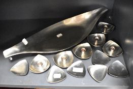 A set of six mid century Danish design candle holders with five similar trays and a larger dish.