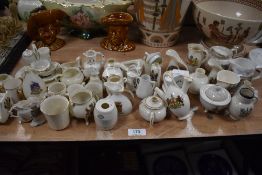 A large collection of crested ware, including interest to Penrith, Ilkley, Harrogate and Edinburgh