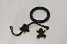 Two frog theme Art Deco costume jewellery pieces including a brooch and a wristband.