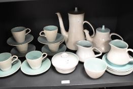An Art Deco Poole Pottery part tea and coffee service in a mottled and green glaze.