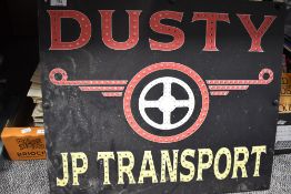 A vintage advertising board for Dusty JP Transport.