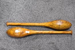 A pair of Victorian Hardwood Indian Clubs or Exercise Meels with worn patina.