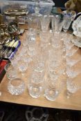 A large collection of clear cut crystal glass wares including Stuart.