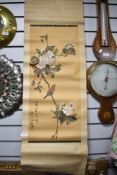 A vintage Chinese scroll hand painted with blossom and song bird, bearing seal stamp.