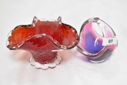 A vintage studio glass bowl in a pink and purple fade signed to base, with a similar Ruby red dish.