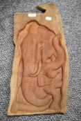 An African hard wood plaque hand carved to depict elephant with cub.
