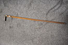 A Victorian walking cane, having hall marks for Birmingham, circa 1897/8 embossed cuff to neck and