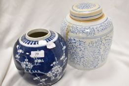 Two antique Chinese ginger jars, one with traditional prunus decoration and a similar larger jar