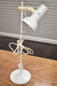 A vintage mid century style adjustable lamp.