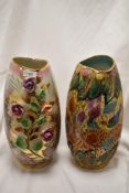 Two mid century vases, one having raised roses with lustre ground, the other with bright bird and