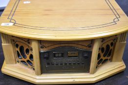 A modern Phonograph model GF665 record player with compact disk and radio cassette.