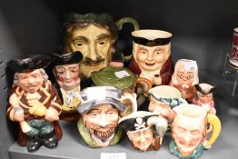 A collection of Toby style character jugs, including Royal Doulton and Kingston pottery.