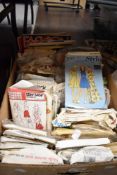 A box full of vintage sewing patterns.
