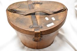 A Victorian Leonards top hat and leather case.