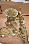 A collection of brass wares including trivet, footed plant stand and goblets.