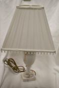 A vintage marble stone carved lamp base with square shade.
