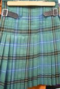 A vintage Scottish men's tartan kilt and suit set.