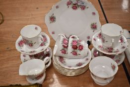 A selection of Royal Minster tea wares, having bold rose transfer pattern.