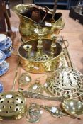 A selection of vintage brass wares including coal bucket, candlesticks, chestnut roaster and fire