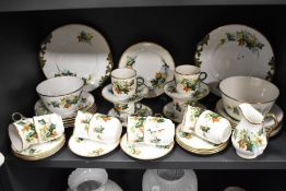 A Victorian porcelain part tea service being decorated with an Ivy leaf and gilt design.