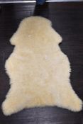 A vintage sheep skin rug or throw. In fine condition.