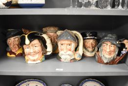 Six Royal Doulton character jugs including Pied Piper, Henry Morgan, Don Quixote, Robinson Crusoe,