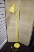 A vintage standard lamp in yellow.