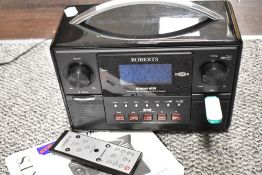 A modern Roberts digital radio Stream 83i, with remote and instructions.